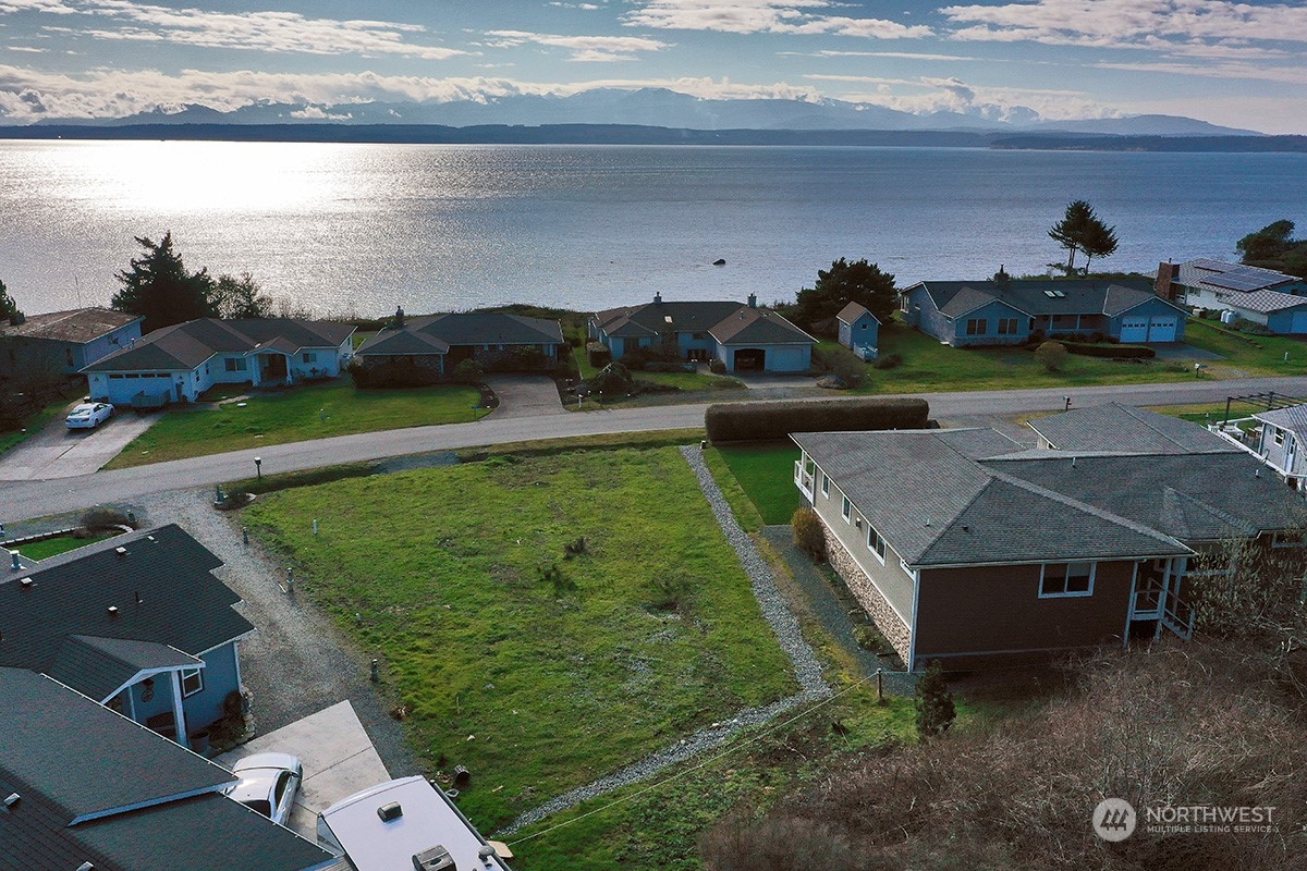 a view of a lake with a yard