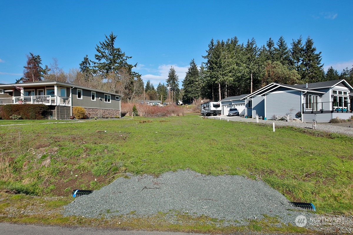0 Dolphin Drive Freeland, WA 98249 - Photo 9 of 19 a view of a house with a big yard and potted plants