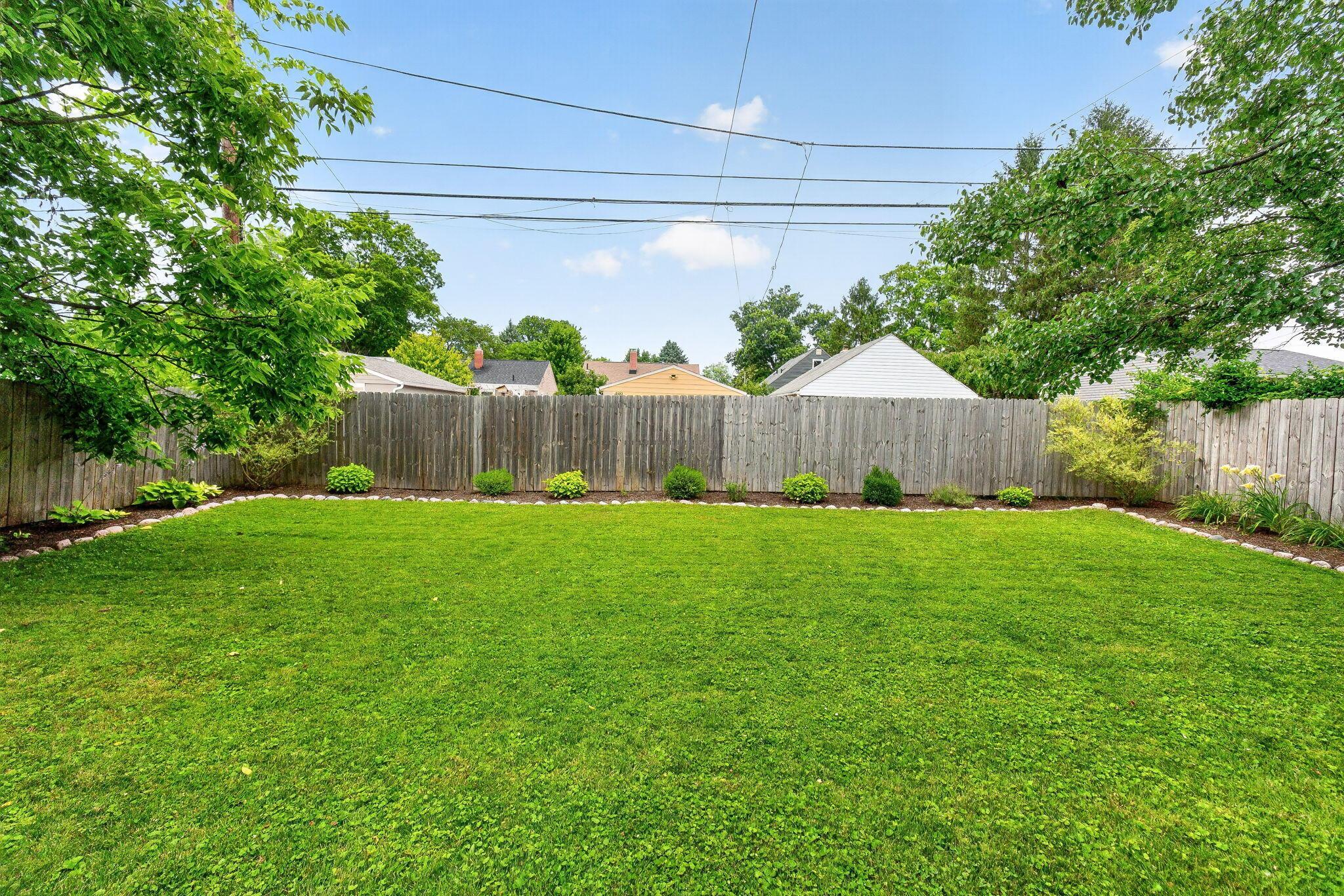 492 Wetmore Road Columbus, OH 43214 - Photo 47 of 55 Expansive lawn area featuring a perimeter privacy fence