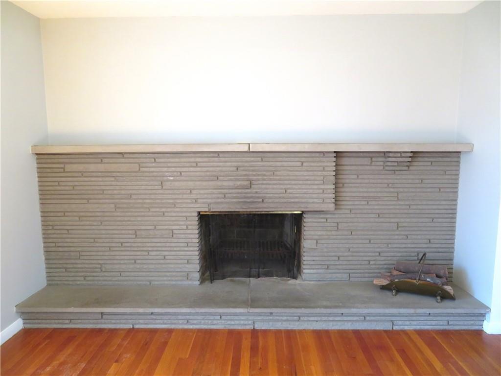 736 Beaver Street Rochester, PA 15074 - Photo 4 of 24 a view of wooden floor and a fireplace