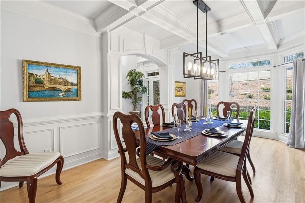 613 Talmadge Lane Canton, GA 30115 - Photo 15 of 84 a dining room with furniture a chandelier and wooden floor