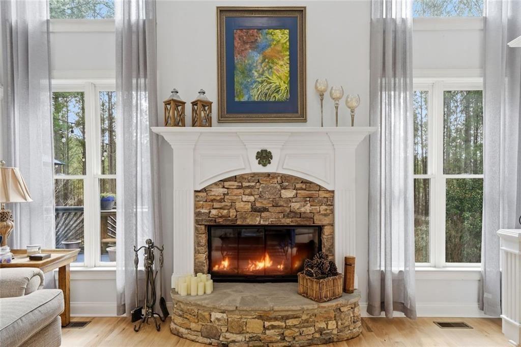 613 Talmadge Lane Canton, GA 30115 - Photo 19 of 84 a living room with a fireplace and a window