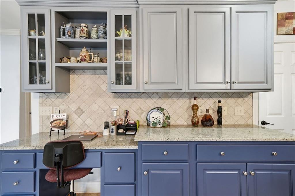 613 Talmadge Lane Canton, GA 30115 - Photo 25 of 84 a kitchen with stainless steel appliances granite countertop a sink dishwasher stove and cabinets