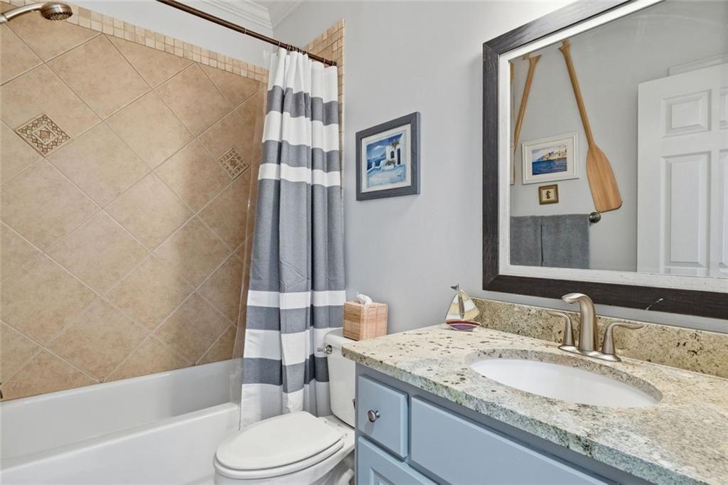 613 Talmadge Lane Canton, GA 30115 - Photo 27 of 84 a bathroom with a granite countertop sink toilet and shower