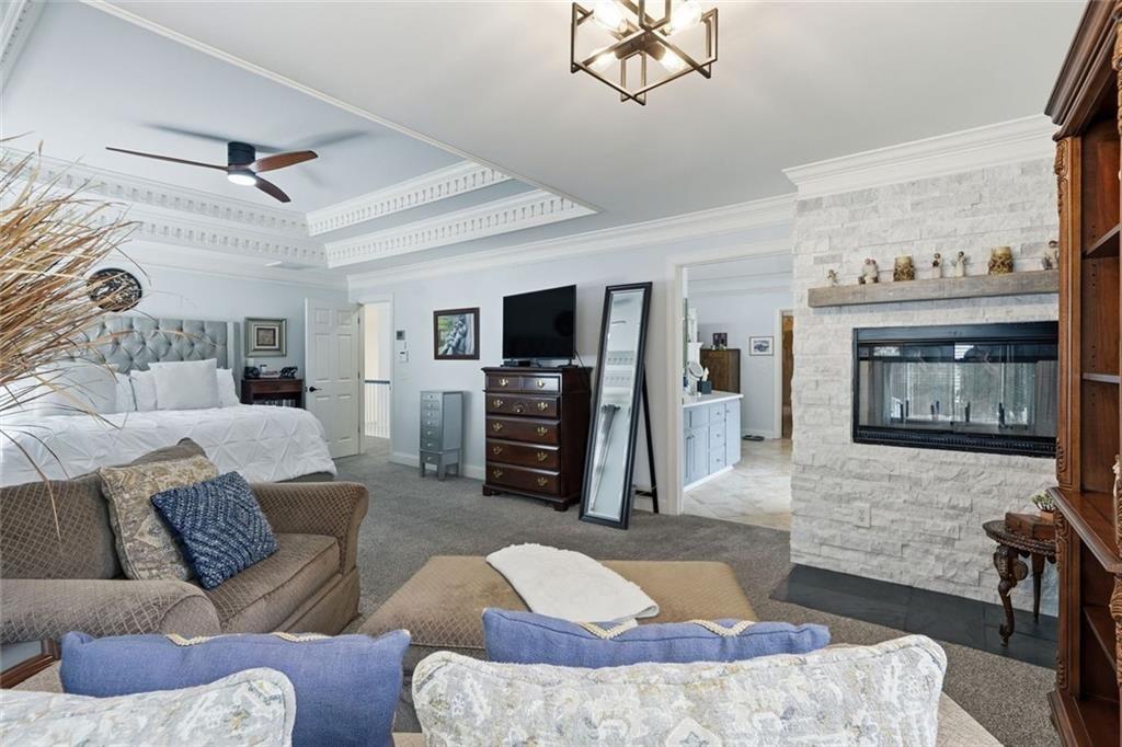 613 Talmadge Lane Canton, GA 30115 - Photo 38 of 84 a living room with furniture and a flat screen tv