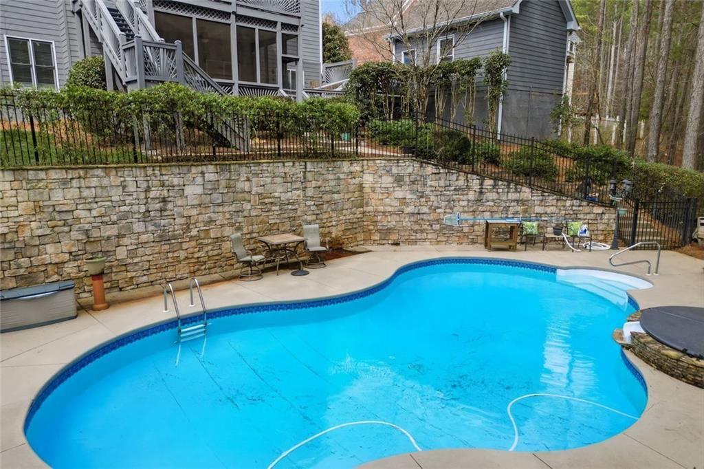 613 Talmadge Lane Canton, GA 30115 - Photo 80 of 84 a view of a swimming pool with an outdoor space