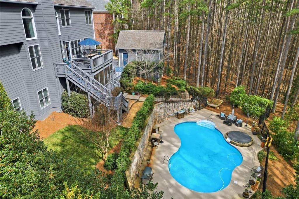 613 Talmadge Lane Canton, GA 30115 - Photo 81 of 84 a view of a house with a yard and sitting area