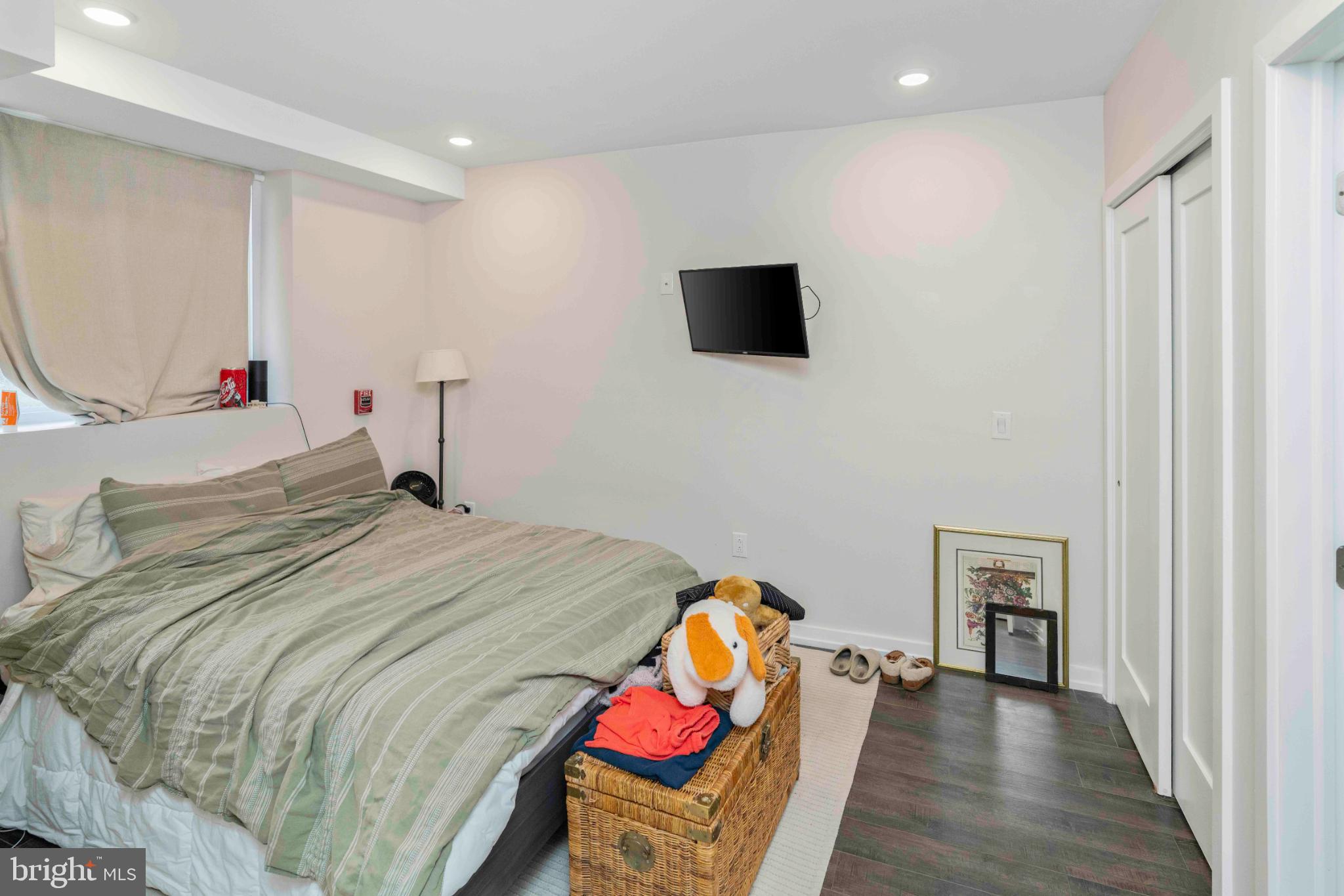 1309 South 20th Street Philadelphia, PA 19146 - Photo 16 of 37 a bedroom with a bed and a flat screen tv
