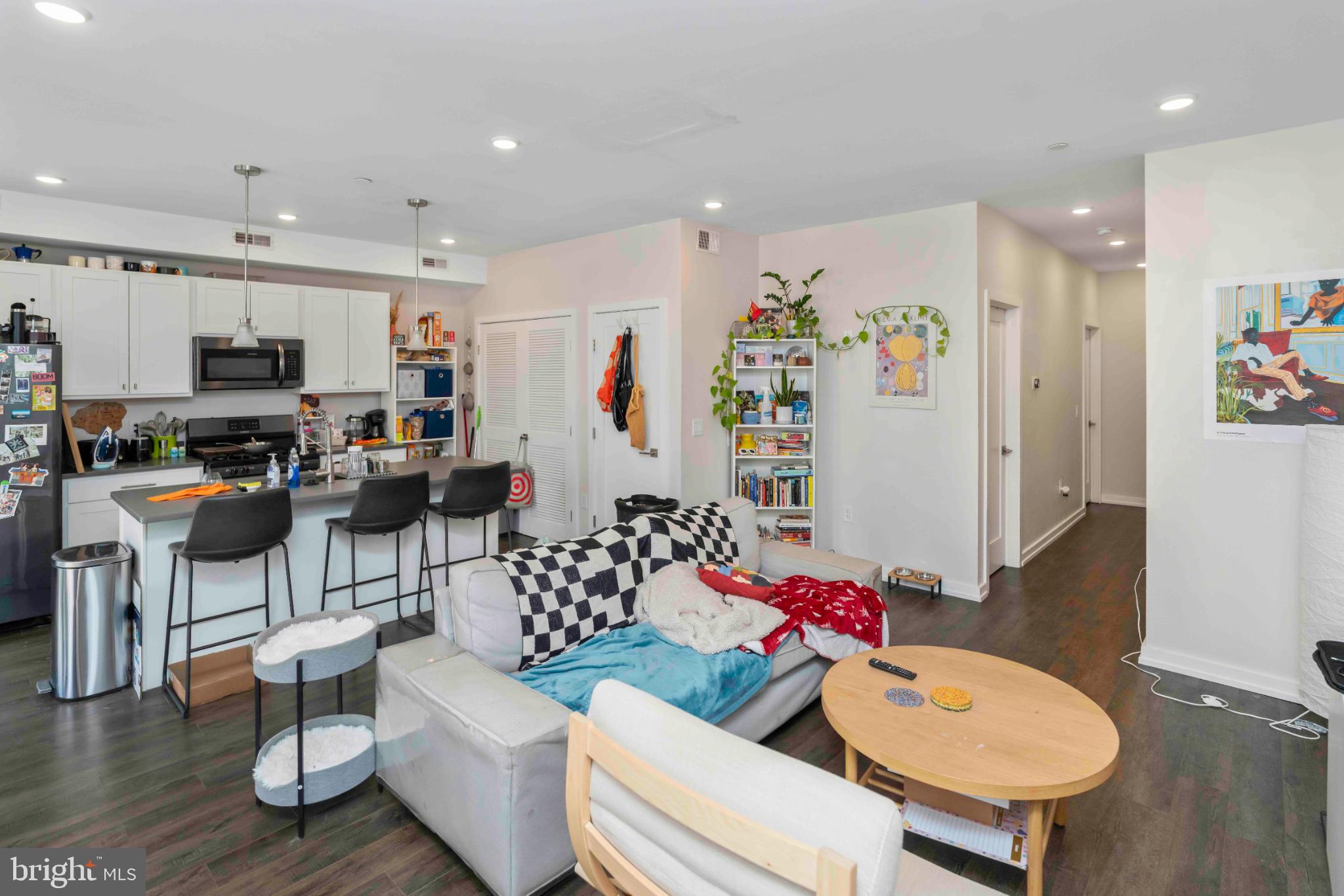 1309 South 20th Street Philadelphia, PA 19146 - Photo 23 of 37 a living room with furniture and kitchen view