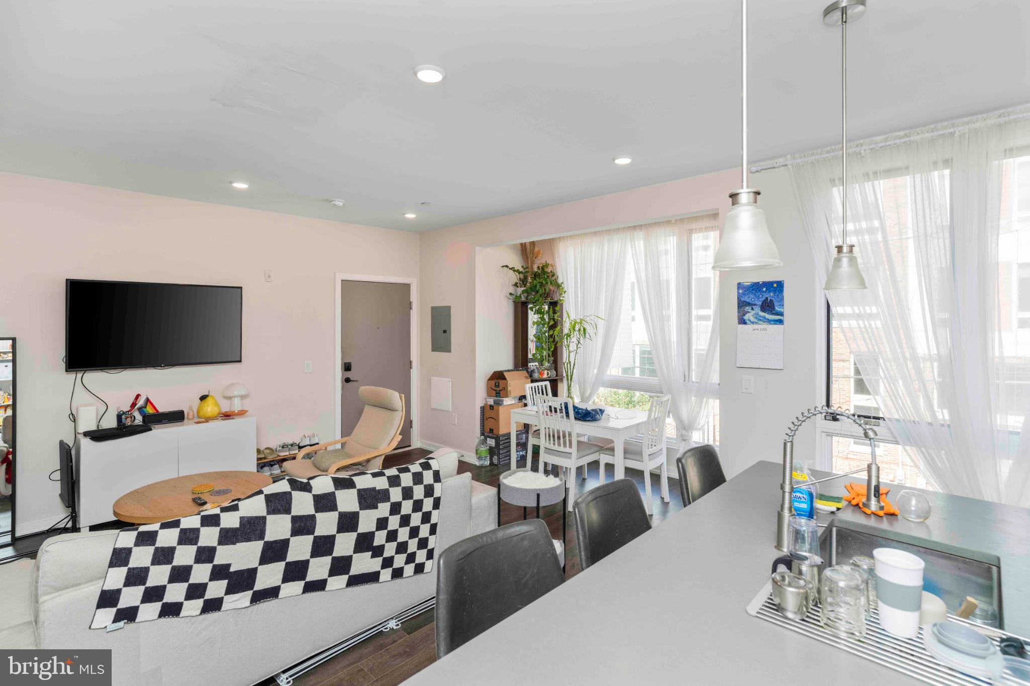 1309 South 20th Street Philadelphia, PA 19146 - Photo 24 of 37 a living room with furniture and a flat screen tv