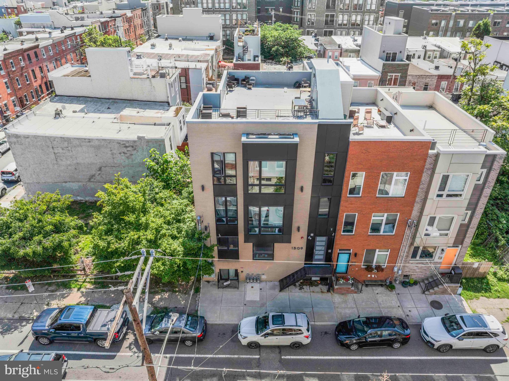 1309 South 20th Street Philadelphia, PA 19146 - Photo 3 of 37 a view of building with cars parked