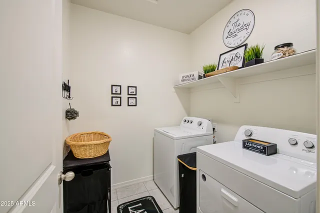a view of storage and utility room with washer and dryer