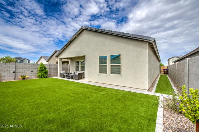 a house with garden in front of it