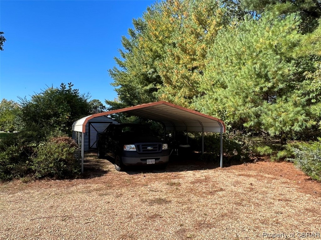 790 Long Point Lane Topping, VA 23169 - Photo 8 of 26 View of parking with a carport