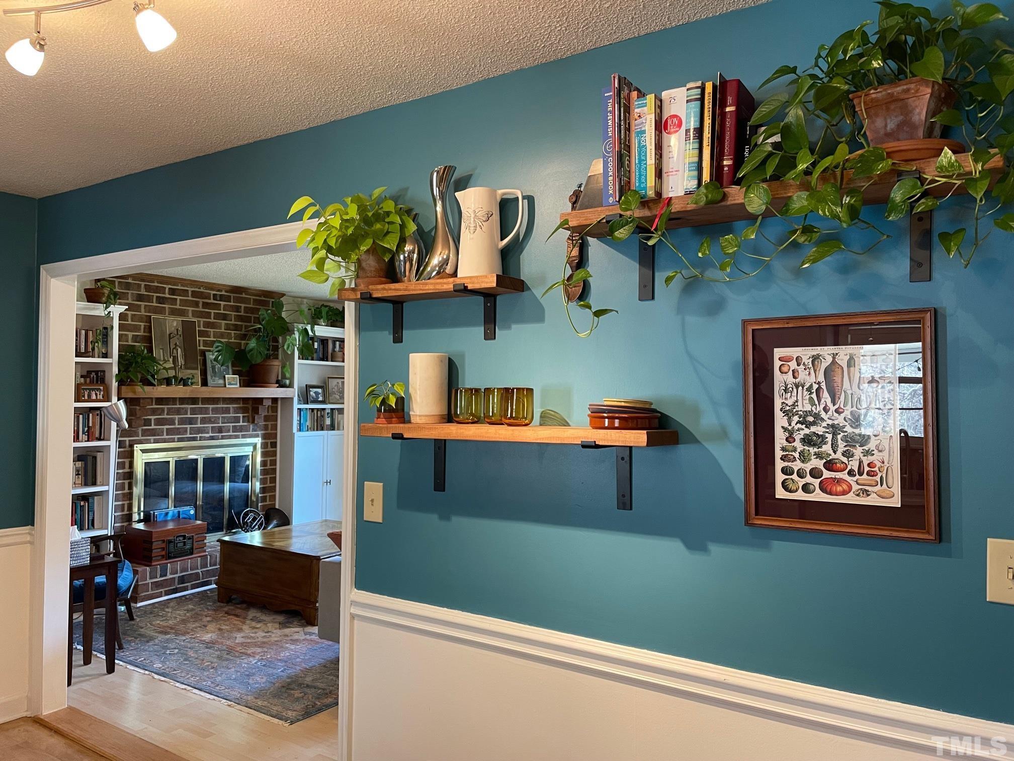 6123 Russell Road Durham, NC 27712 - Photo 8 of 23 a living room with furniture and a potted plant