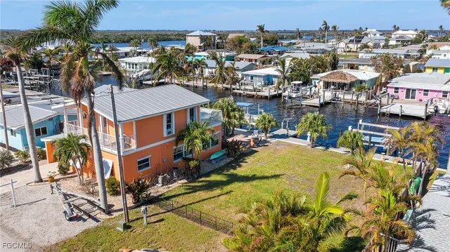 an aerial view of a house with a ocean view