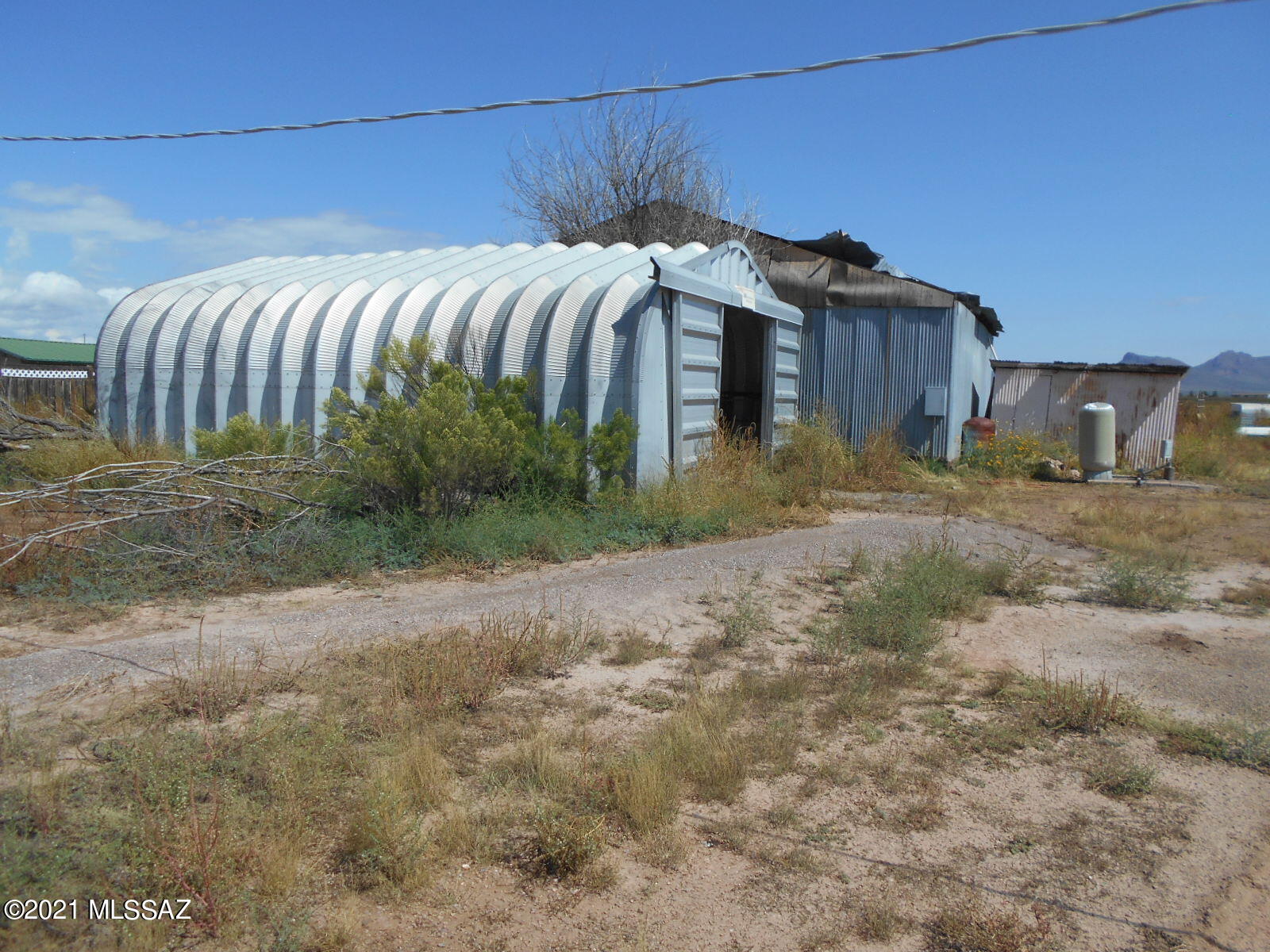 5321 North Rocky Road Douglas, AZ 85607 - Photo 9 of 41 a view of a dry yard with wooden fence