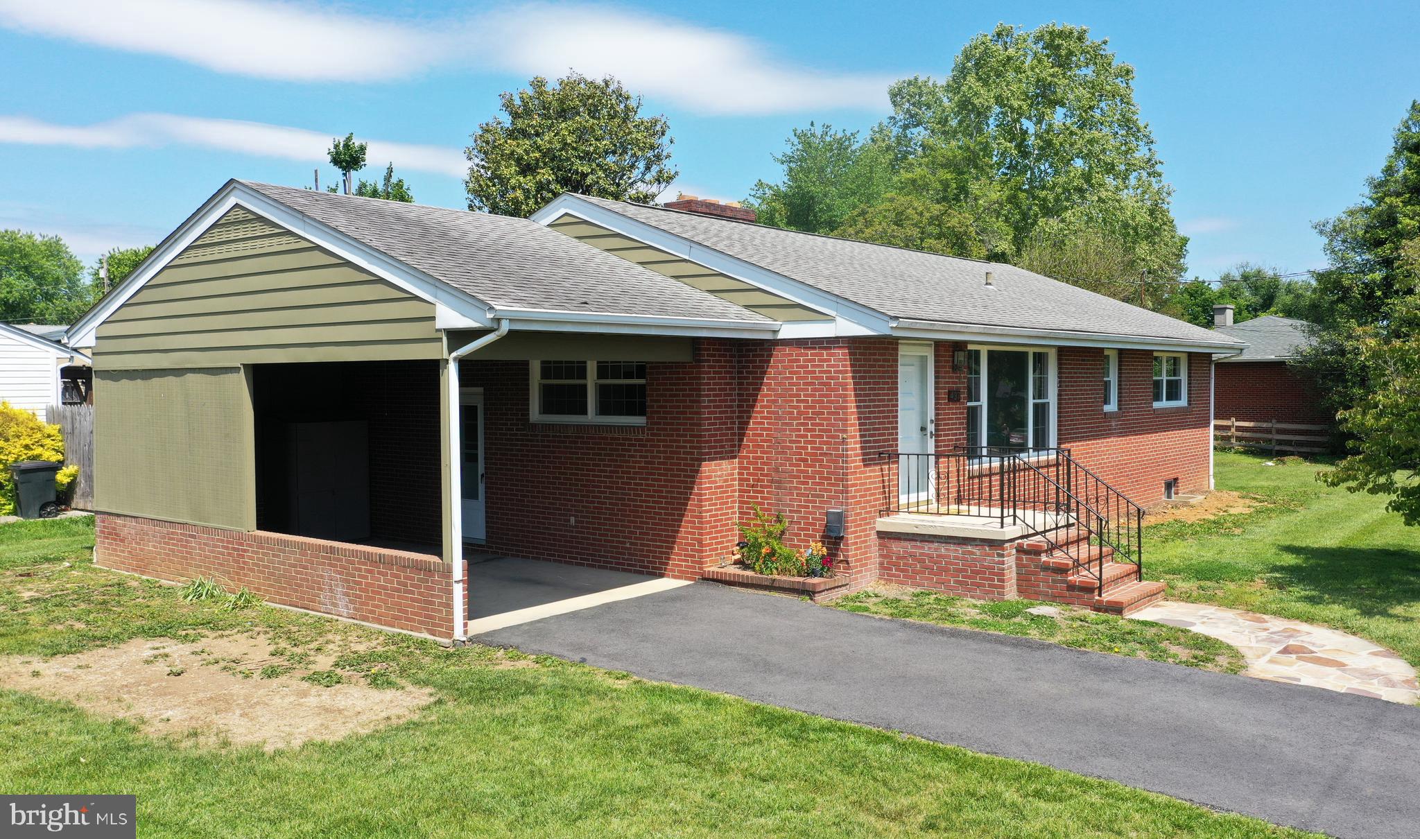 437 Beechcroft Road Winchester, VA 22601 - Photo 46 of 52 a front view of a house with a yard