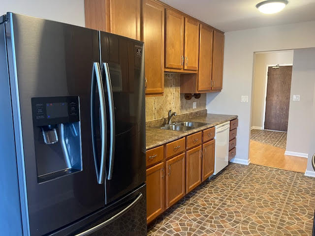 711 South River Road, Unit 511 Des Plaines, IL 60016 - Photo 14 of 23 a kitchen with stainless steel appliances granite countertop a refrigerator and a sink