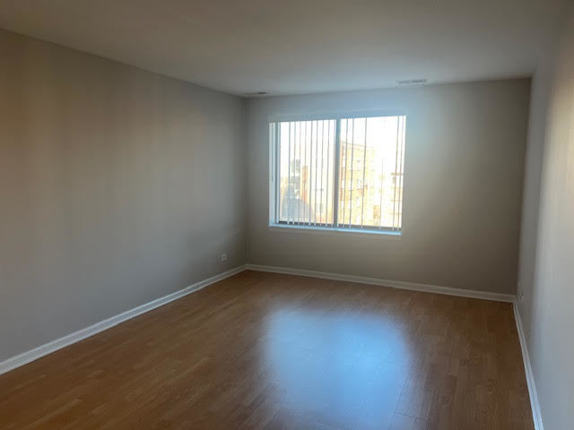 711 South River Road, Unit 511 Des Plaines, IL 60016 - Photo 15 of 23 an empty room with a window