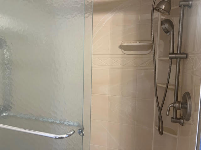 711 South River Road, Unit 511 Des Plaines, IL 60016 - Photo 18 of 23 a bathroom with a shower