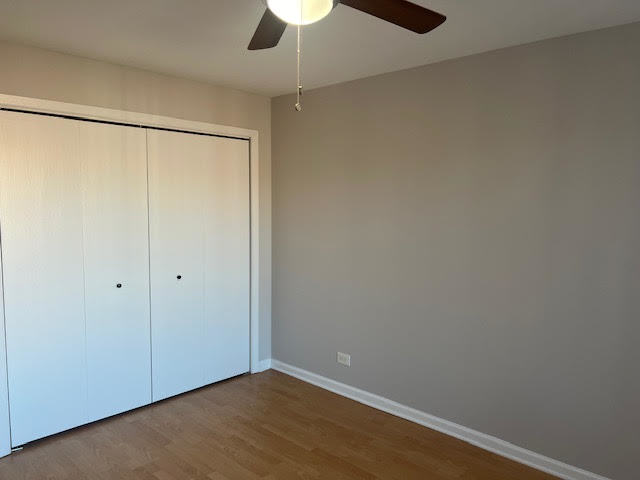 711 South River Road, Unit 511 Des Plaines, IL 60016 - Photo 19 of 23 a view of an empty room with a fan