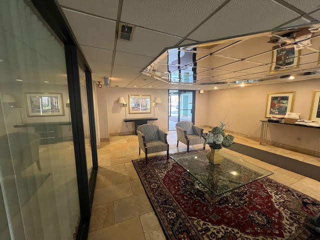 711 South River Road, Unit 511 Des Plaines, IL 60016 - Photo 2 of 23 a dining room with lots of furniture and a chandelier