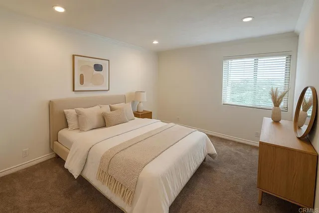 a bedroom with bed and window