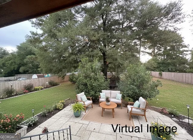 a view of a terrace with furniture