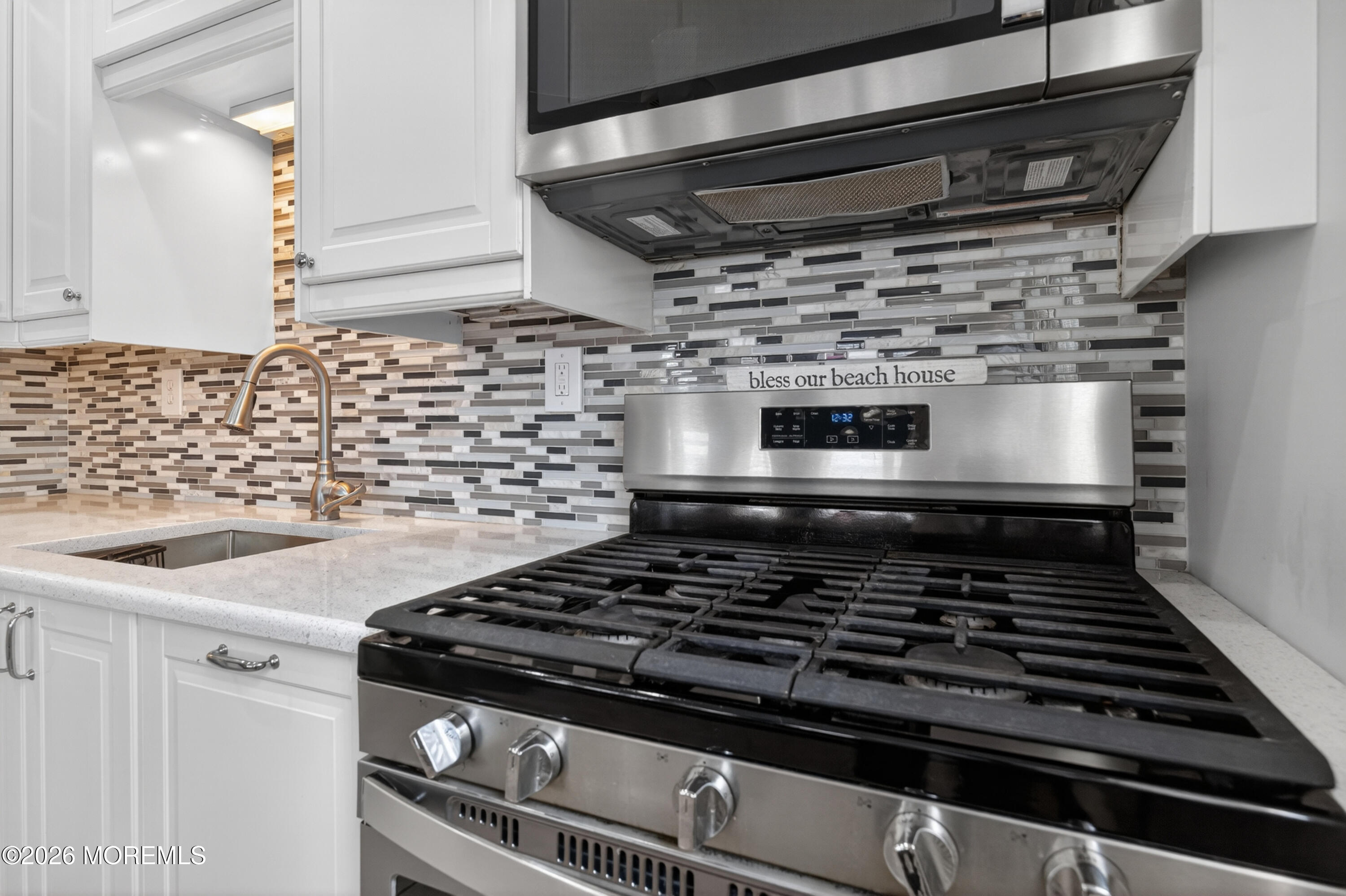 65 Heck Avenue Ocean Grove, NJ 07756 - Photo 18 of 37 a stove top oven sitting inside of a kitchen