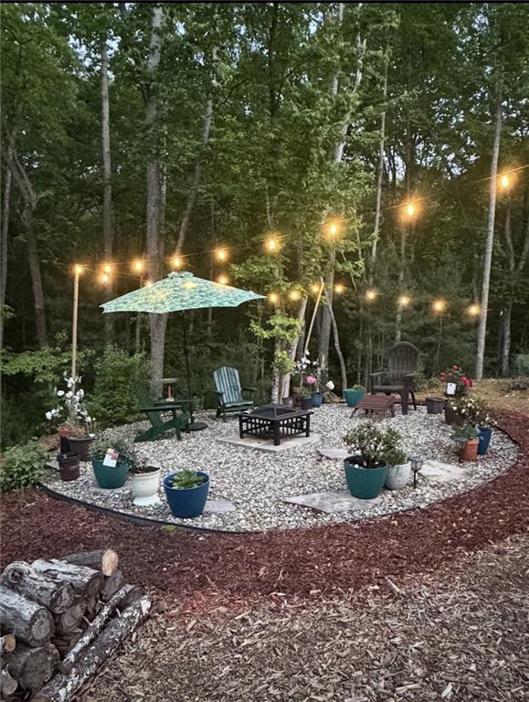 191 Oakwood Road Blairsville, GA 30512 - Photo 5 of 43 a view of a patio with chairs and tables
