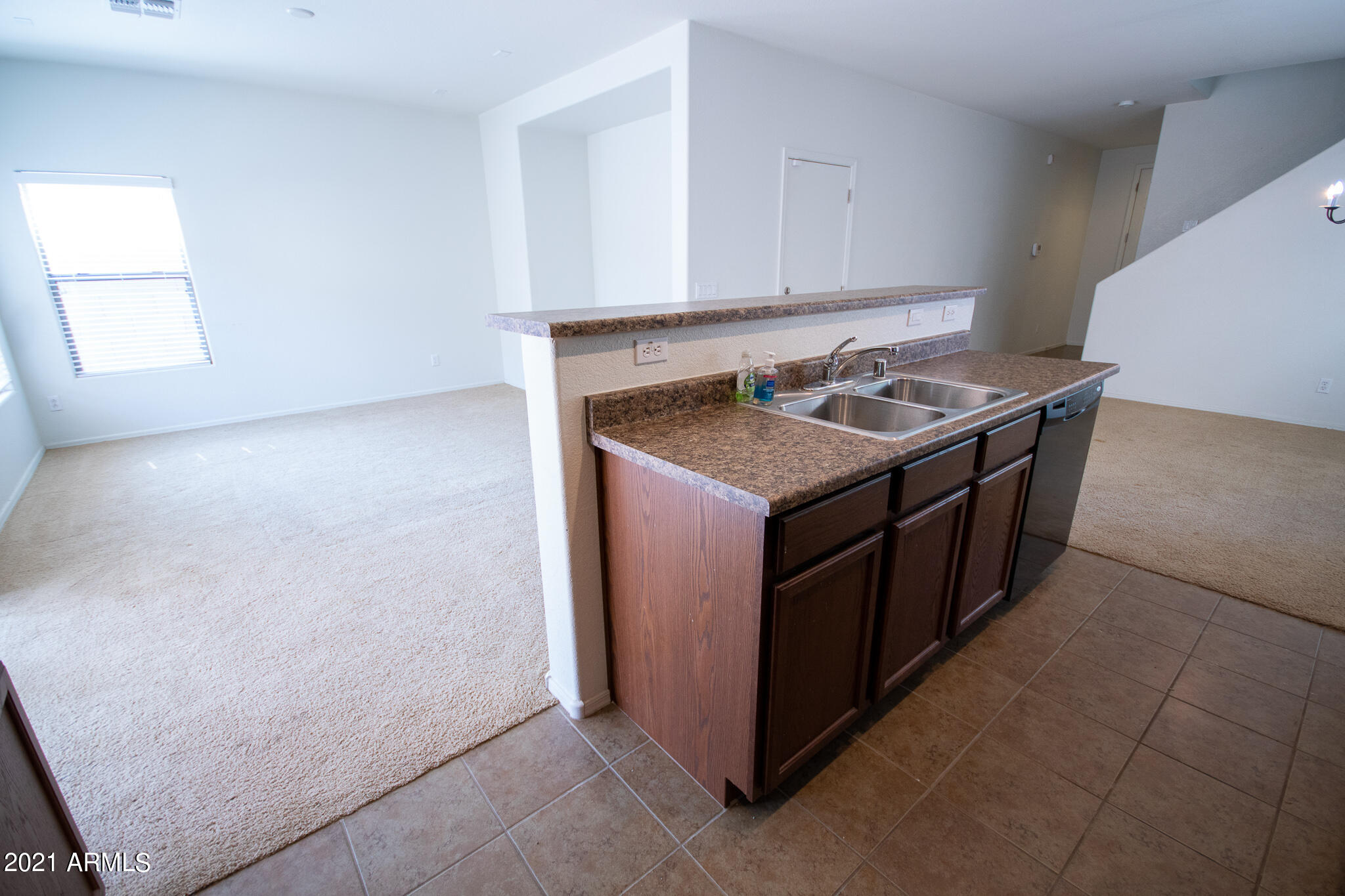 6433 West Harwell Road Laveen, AZ 85339 - Photo 6 of 18 a kitchen with a stove and a microwave oven