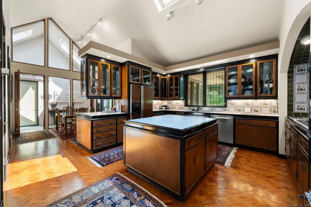 a kitchen with stainless steel appliances granite countertop a stove and a refrigerator