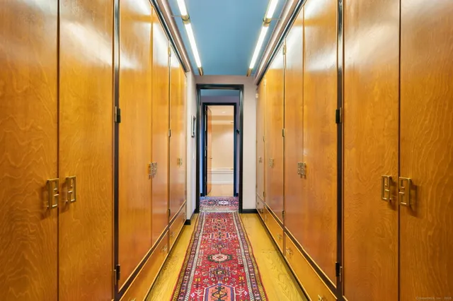 a view of a bathroom with a shower and wooden floor