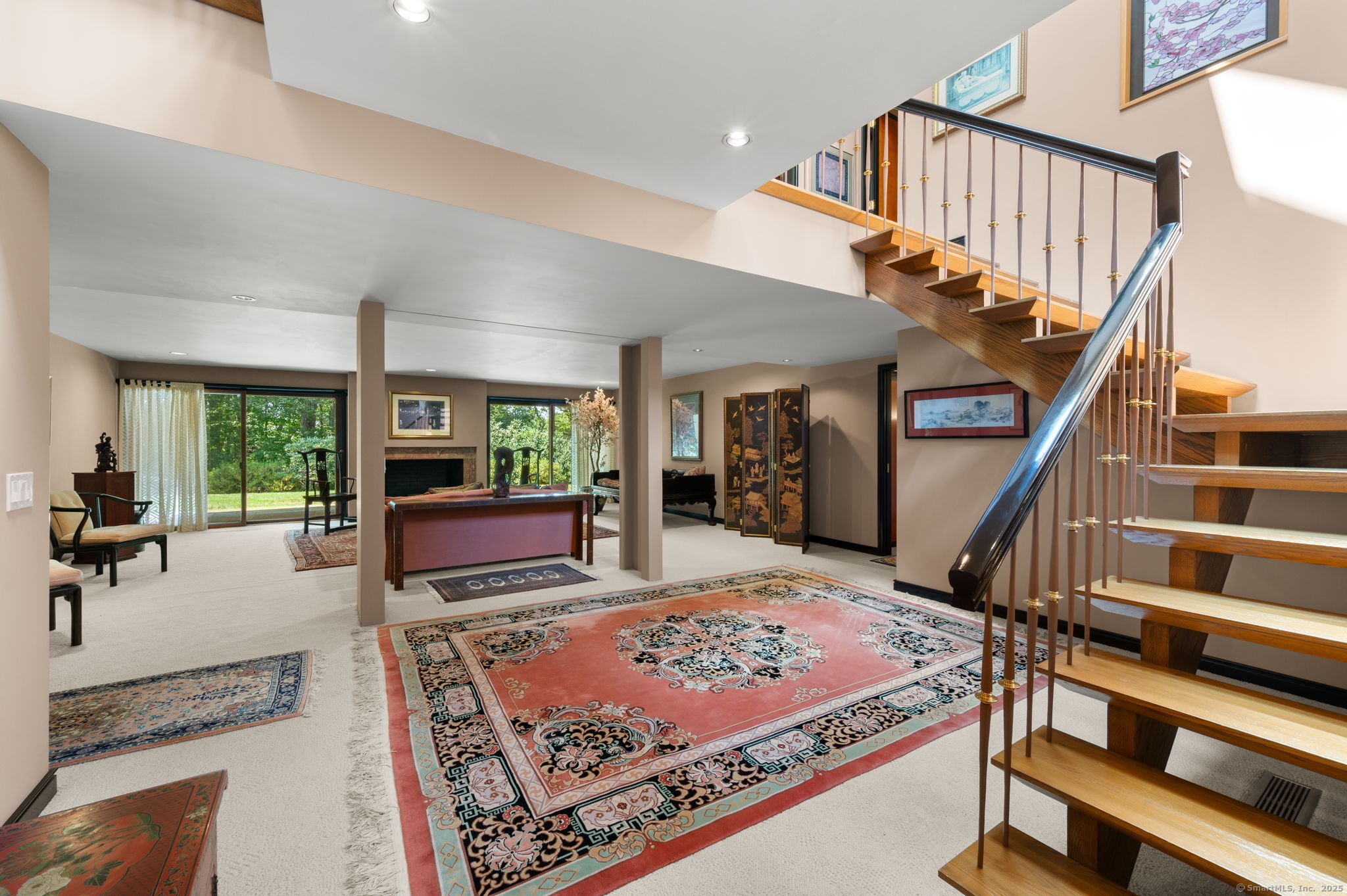 66 Cove Road Lyme, CT 06371 - Photo 24 of 38 a living room with furniture and a rug