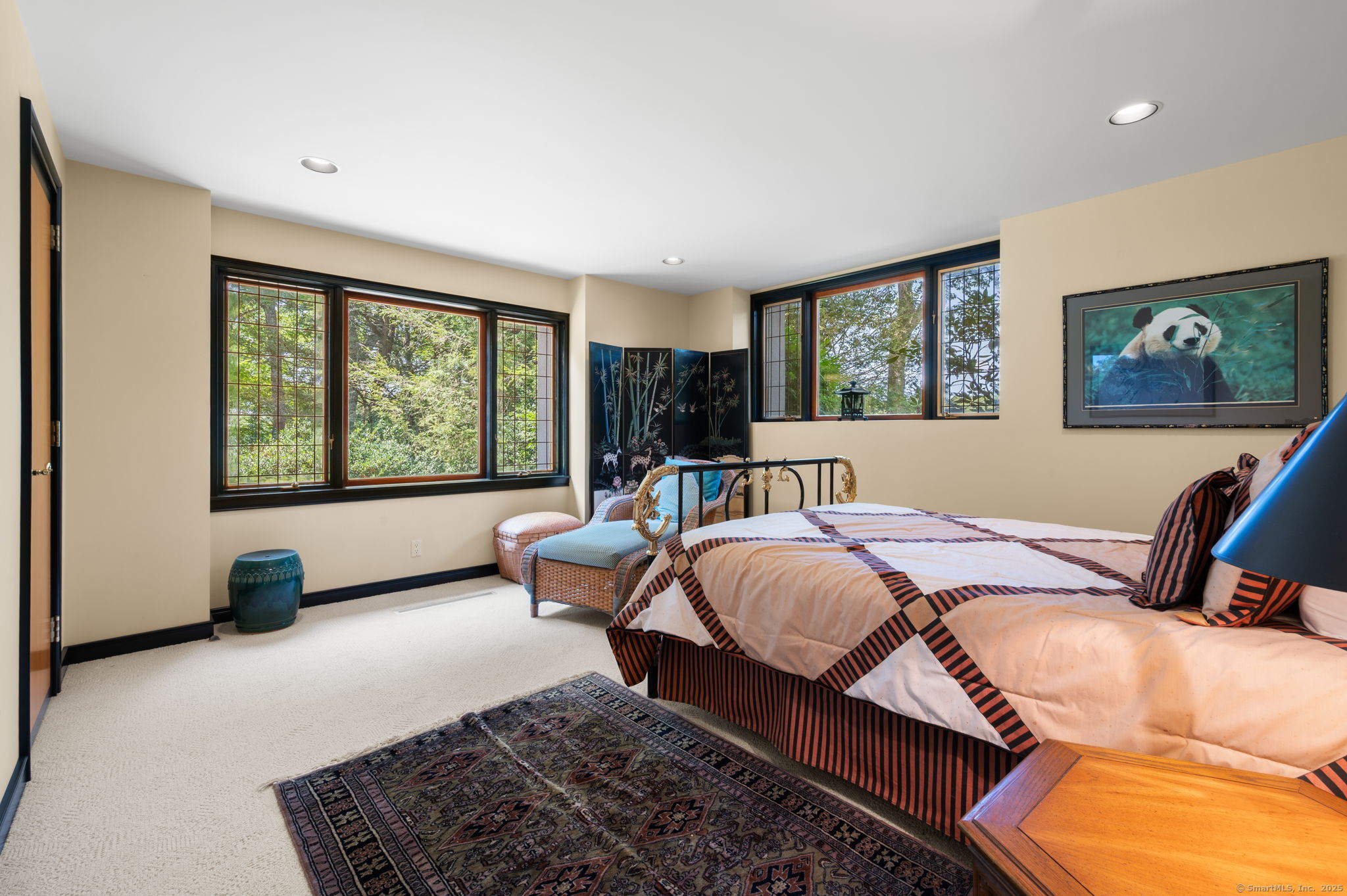 66 Cove Road Lyme, CT 06371 - Photo 27 of 38 a bed room with a bed and a couch