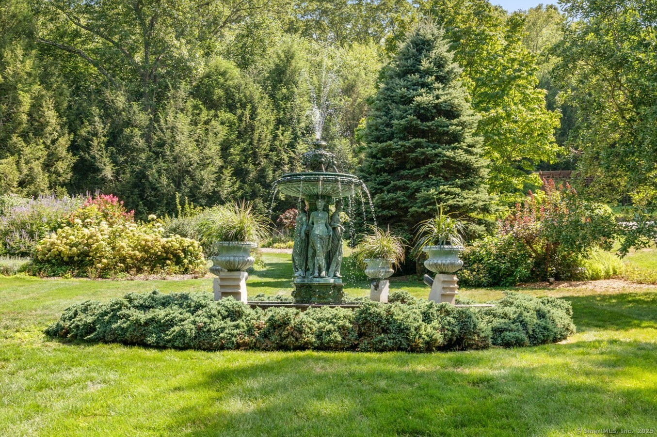 66 Cove Road Lyme, CT 06371 - Photo 34 of 38 a view of a garden with large trees