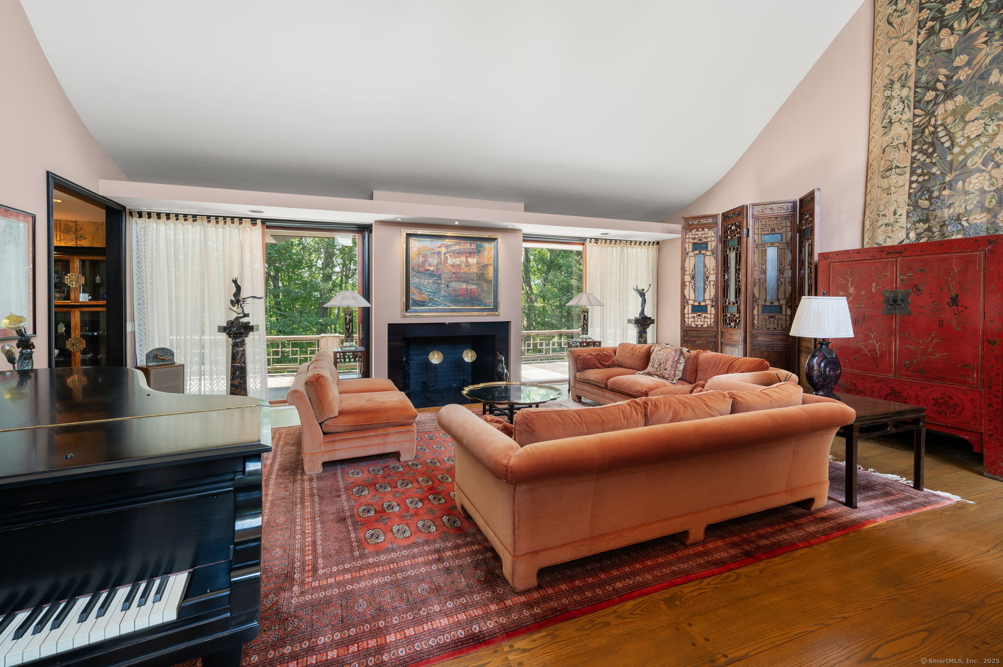 66 Cove Road Lyme, CT 06371 - Photo 8 of 38 a living room with furniture and a fireplace