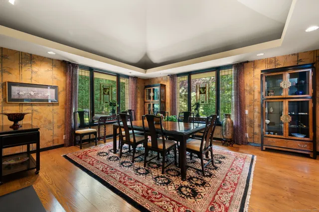 a view of a dining room with furniture window and wooden floor