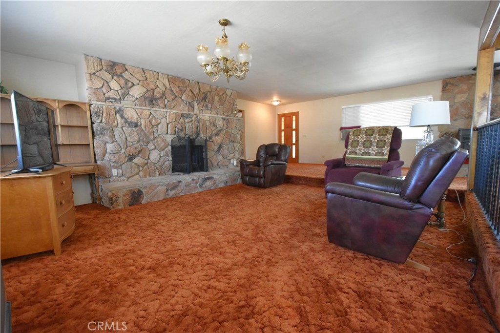 5409 Highway 3 Etna, CA 96027 - Photo 18 of 58 a living room with furniture and a chandelier