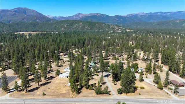 a view of a town with mountains in the background