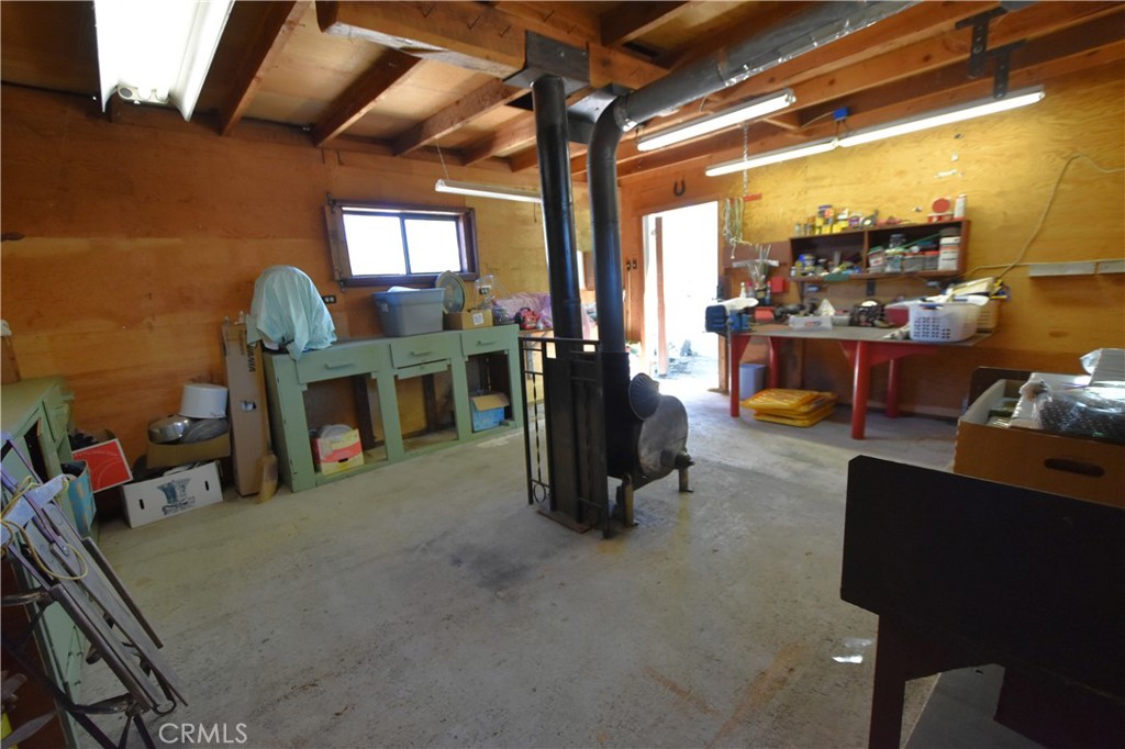 5409 Highway 3 Etna, CA 96027 - Photo 35 of 58 a living room with furniture a flat screen tv and floor to ceiling window