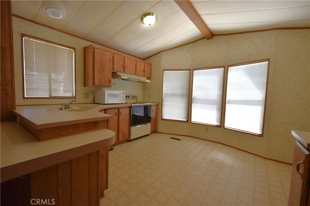 5409 Highway 3 Etna, CA 96027 - Photo 36 of 58 a kitchen with stainless steel appliances a sink stove and cabinets
