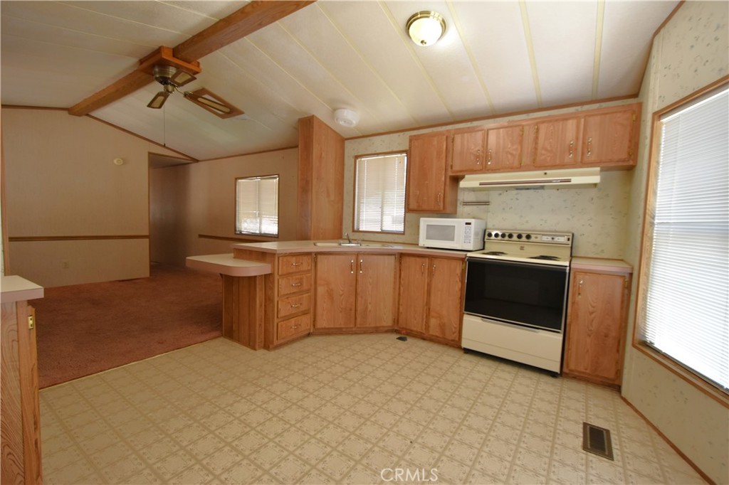 5409 Highway 3 Etna, CA 96027 - Photo 37 of 58 a kitchen with stainless steel appliances a sink and a refrigerator