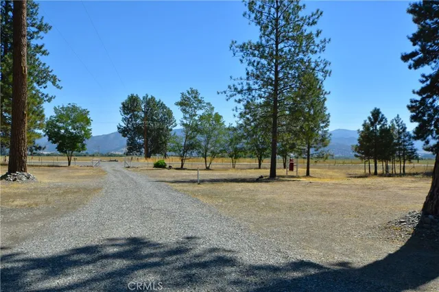 a view of a house with backyard porch and sitting area