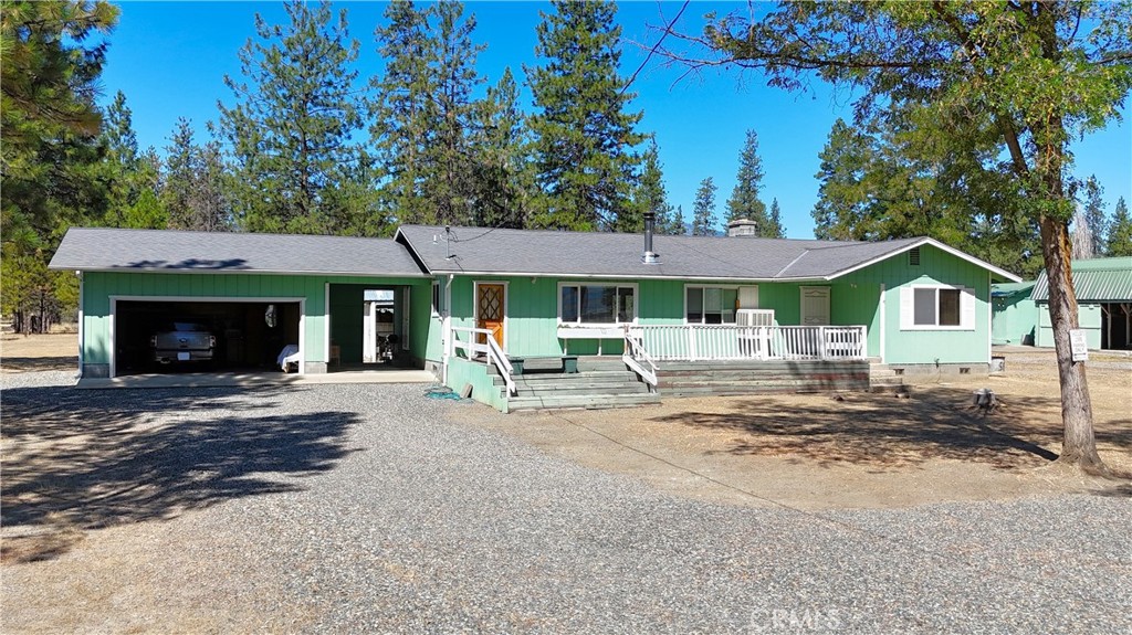 5409 Highway 3 Etna, CA 96027 - Photo 8 of 58 a patio with a table and chairs under an umbrella