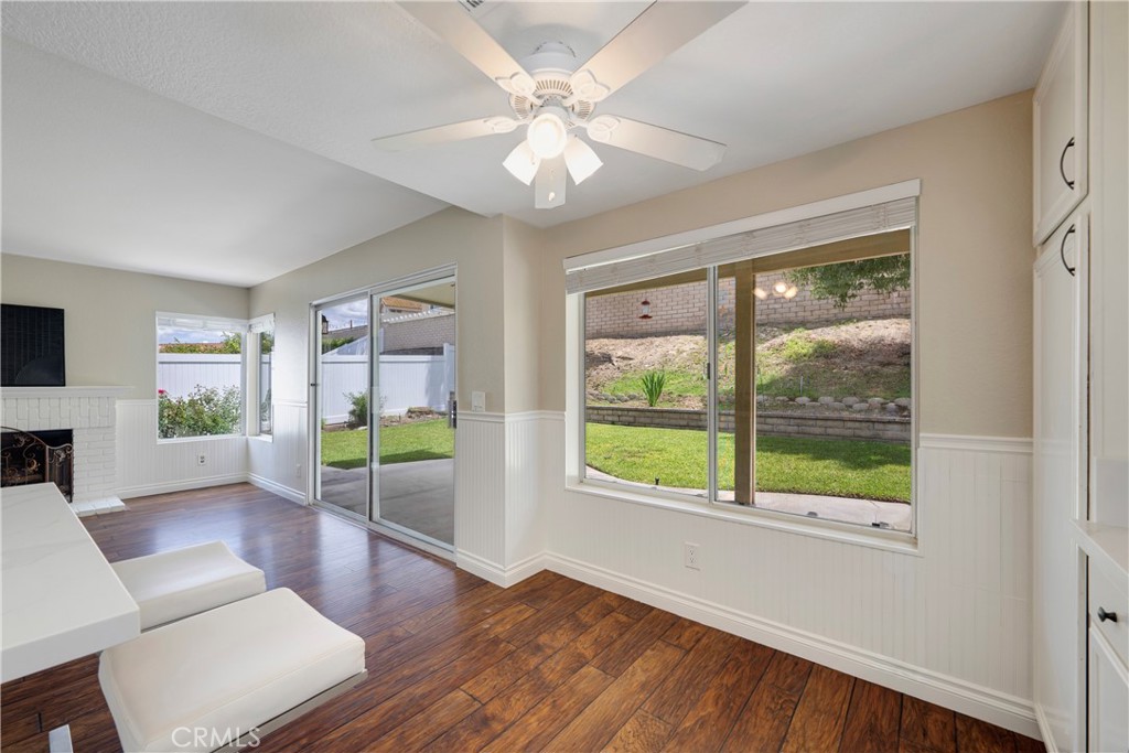 4817 Golden Ridge Drive Corona, CA 92878 - Photo 22 of 70 a living room with furniture and a large window with wooden floor