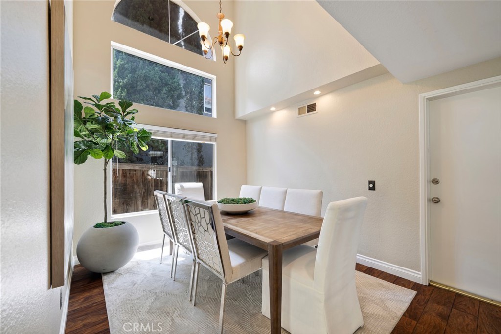 4817 Golden Ridge Drive Corona, CA 92878 - Photo 26 of 70 a view of a dining room with furniture and a potted plant