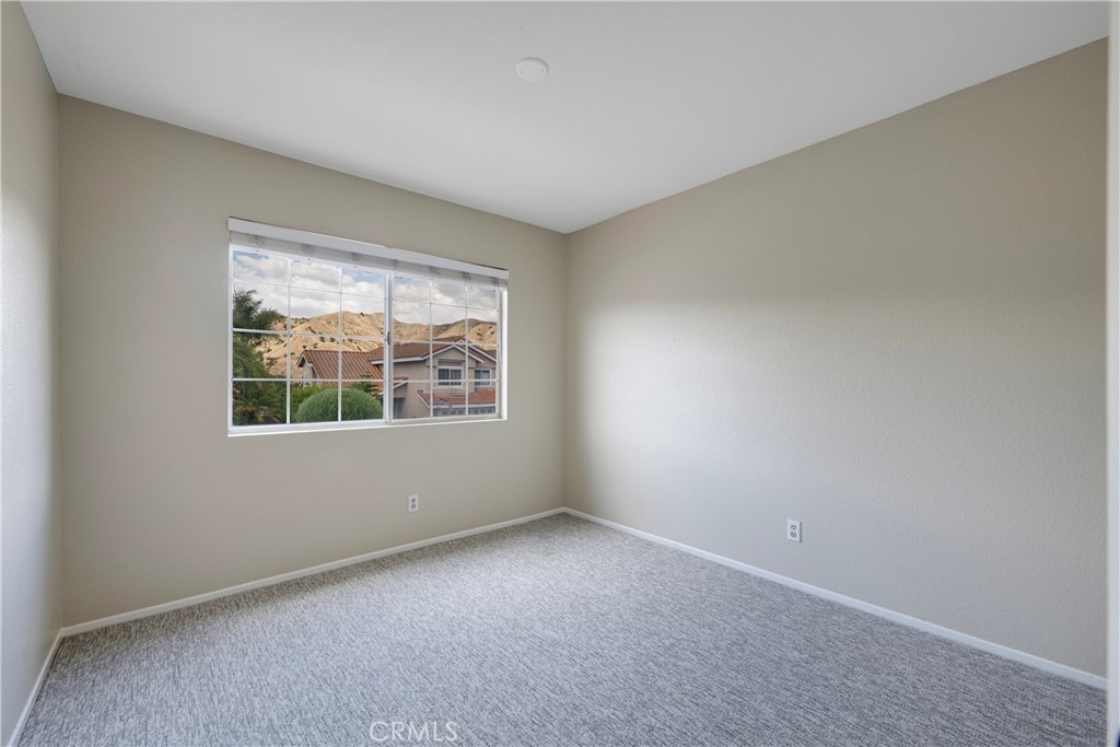 4817 Golden Ridge Drive Corona, CA 92878 - Photo 31 of 70 an empty room with a window