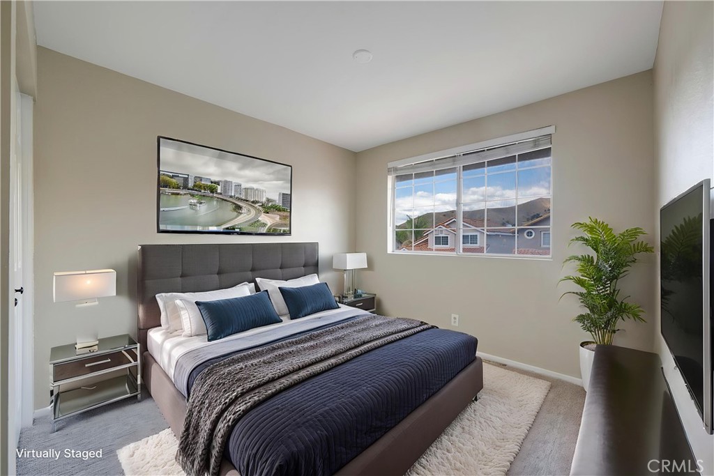 4817 Golden Ridge Drive Corona, CA 92878 - Photo 32 of 70 a bedroom with a large bed and a potted plant